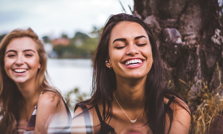 Two young women smiling