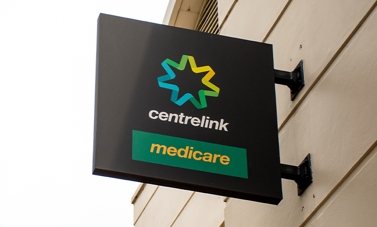 Medicare and Centrlink sign outside of a building.