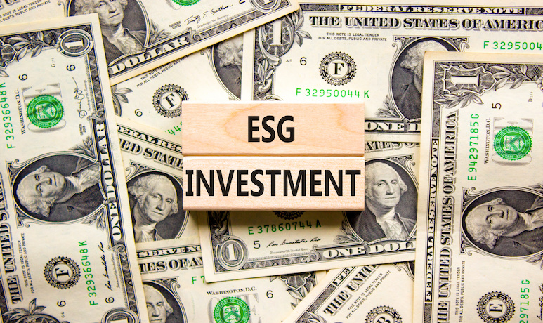ESG text and dollar bills