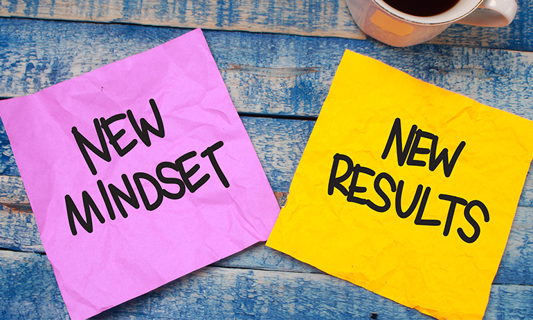 two sticky notes saying new mindset new results