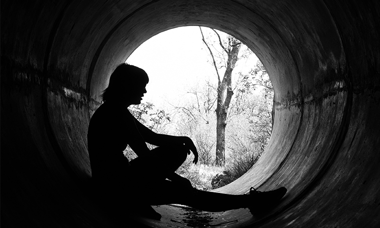 young person in tunnel