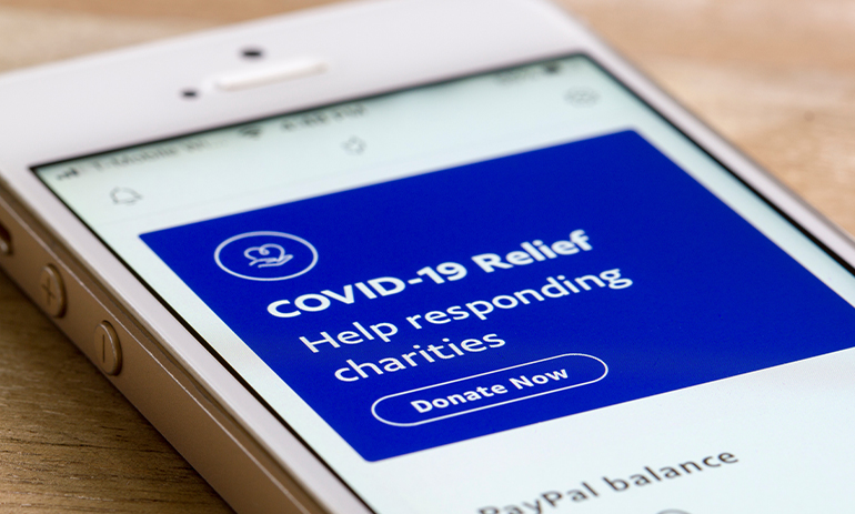 COVID-19 Relief donation page is seen when launching the PayPal mobile app on a smartphone