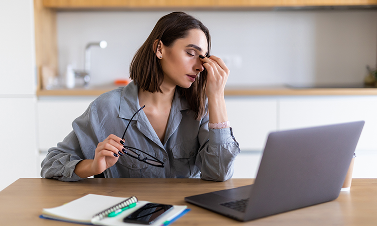 stressed woman working on laptop