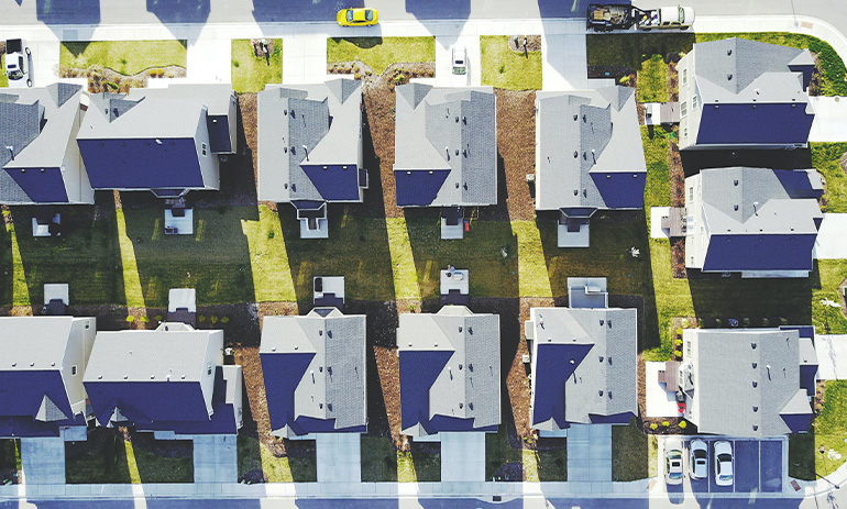 An aerial view showing the roofs of houses.
